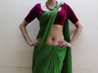 Spy vid 52. Horny indian wife in saree doing a strip navel show